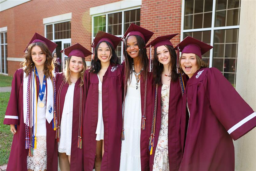Graduates wearing maroon robes